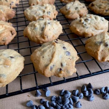 cookies cooling on a rack with chocolate chips