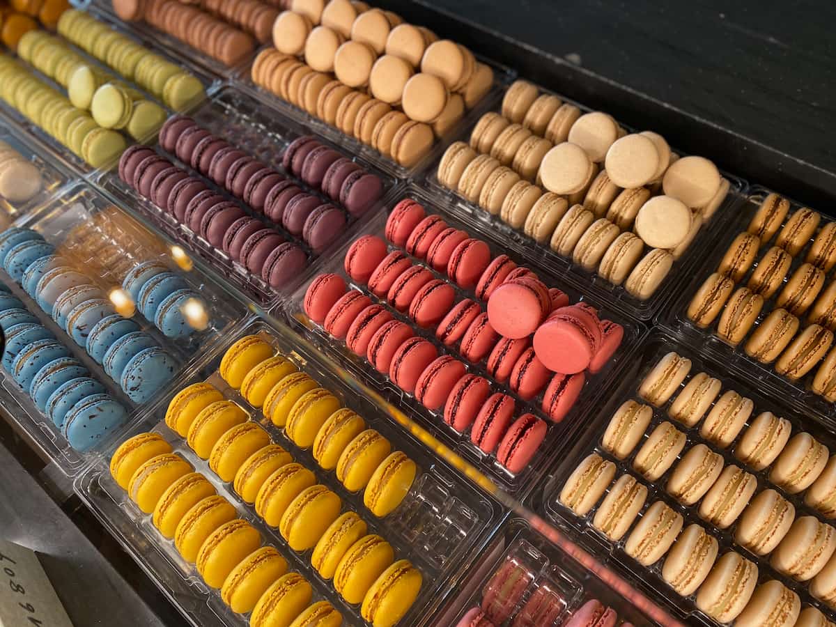rows of colourful macs in a popular Paris store