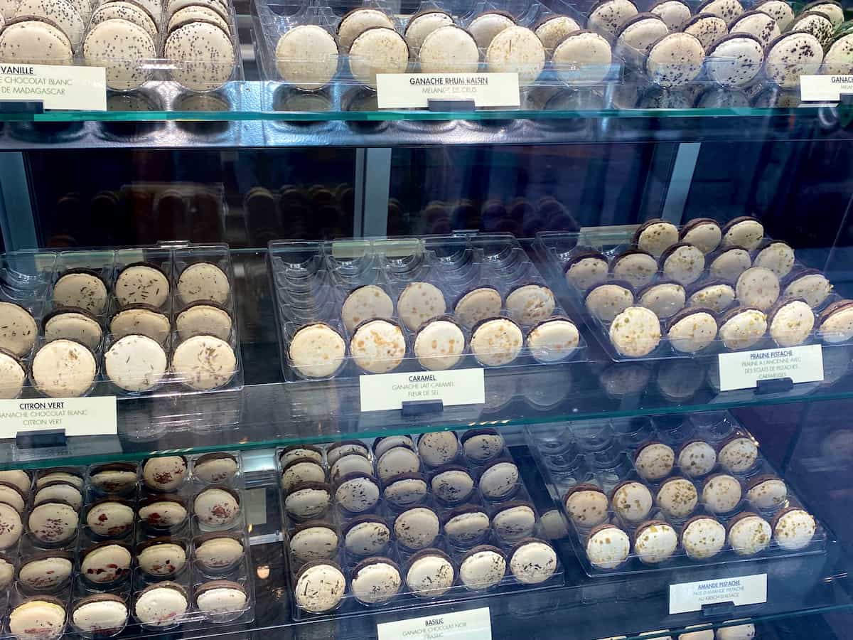 window of chocolate and cream macarons