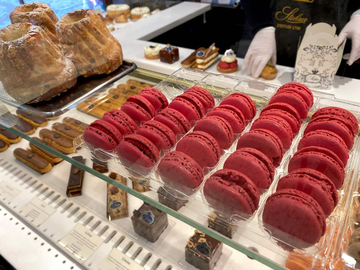 raspberry pink macarons on the patisserie counter