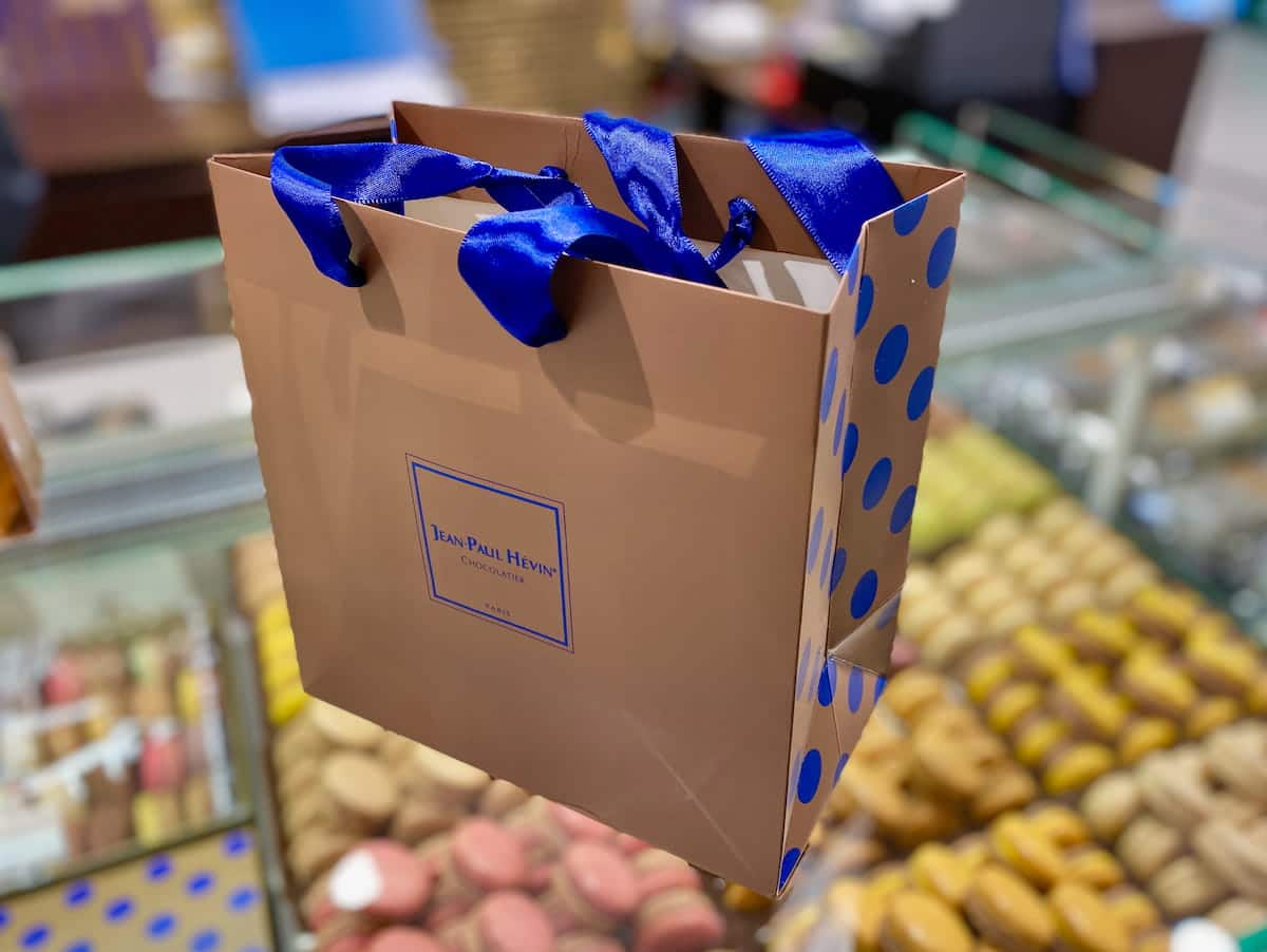 chocolate brown patisserie bag with blue spots and ribbons