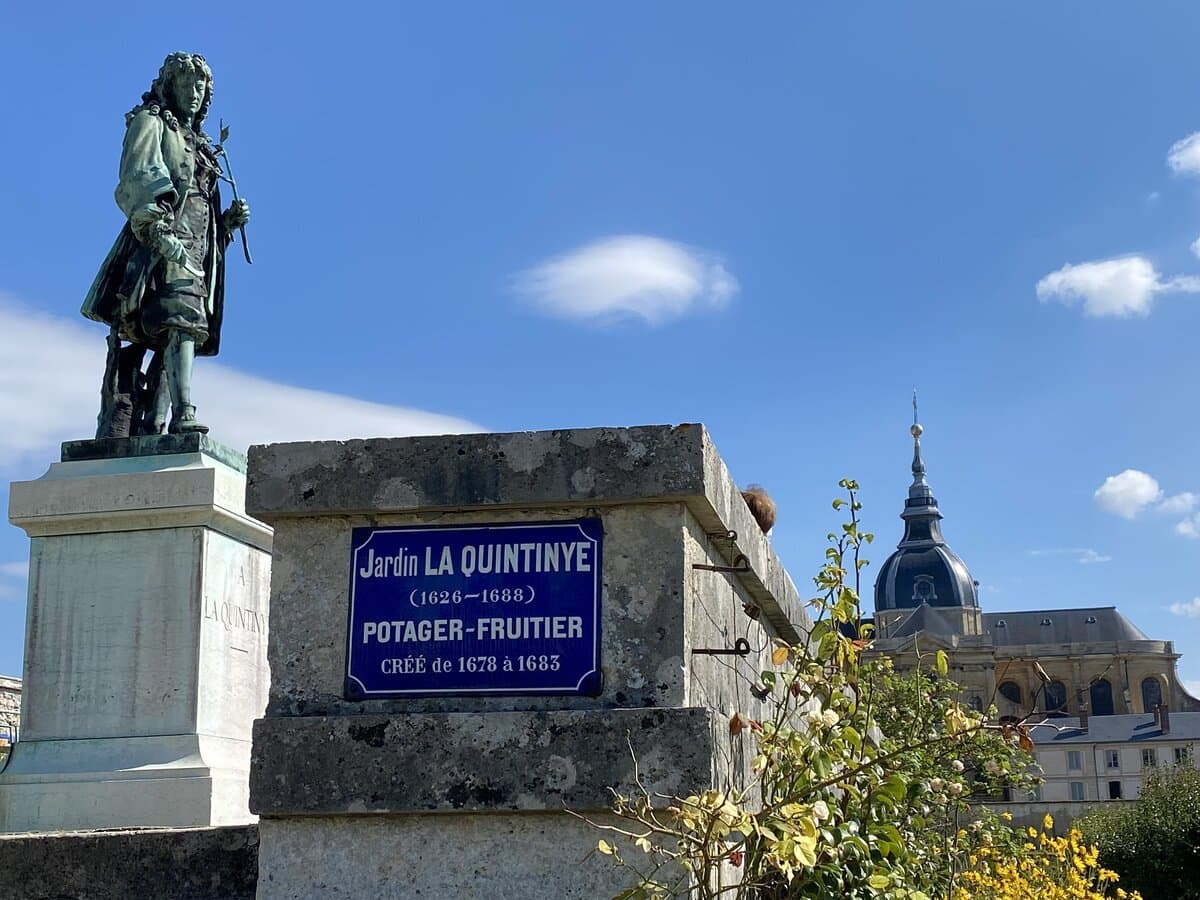 versailles statue of quintinye overlooking vegetable gardens