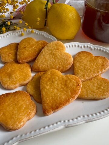 honey biscuits or cookies, golden, glazed and in love heart shapes