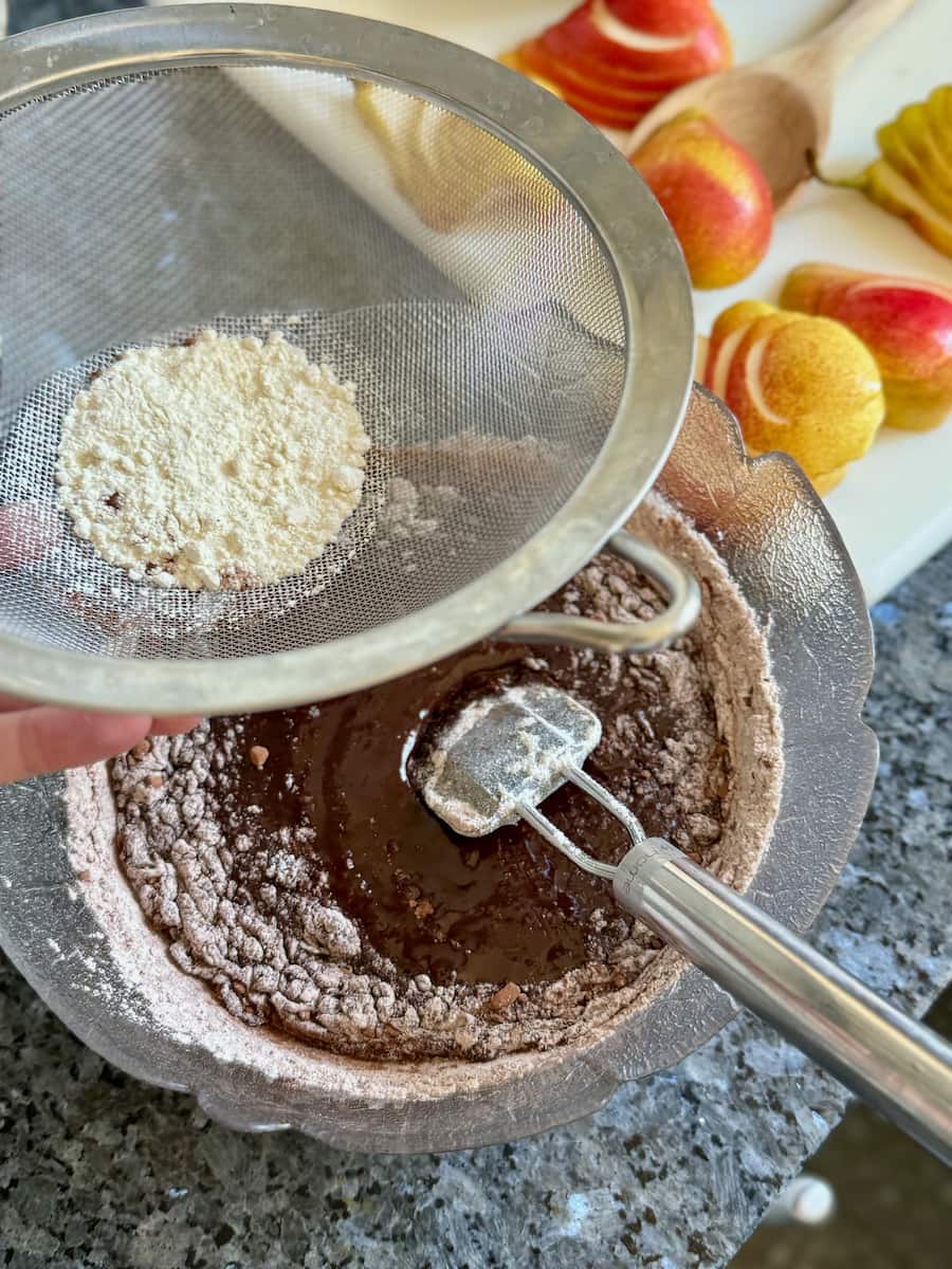 sieve the cocoa powder and flour together into the chocolate mixture