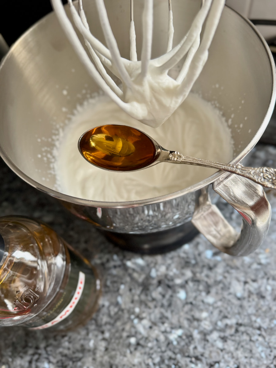 adding a tablespoon of Whisky liqueur to whipped cream