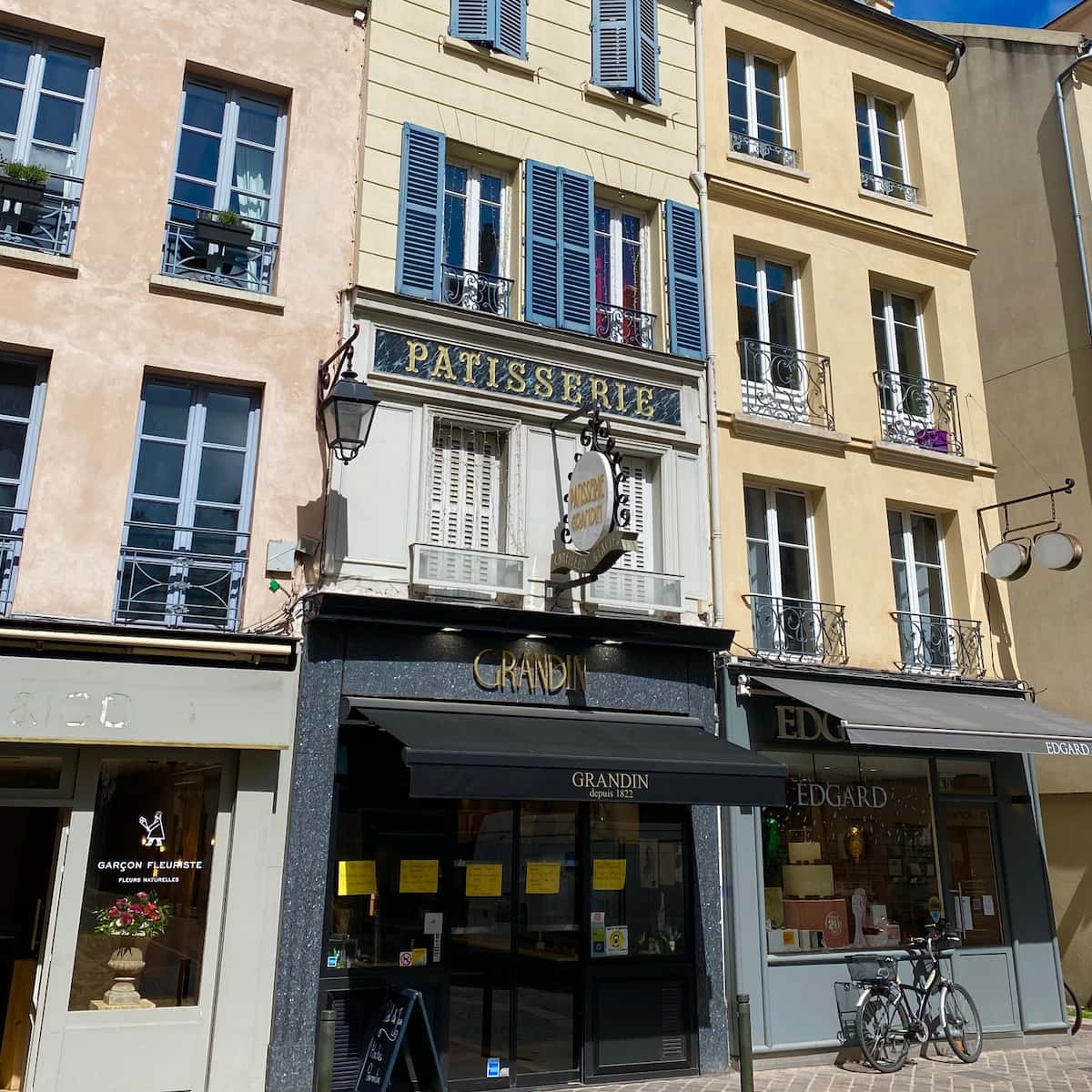 patisserie shopfront with french shutters