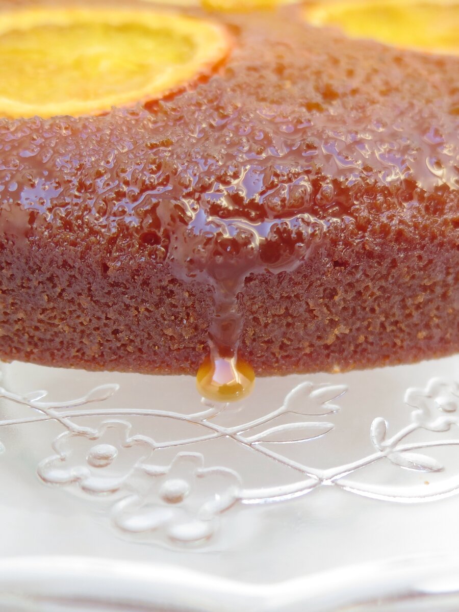 orange chestnut cake with drip of caramel on plate