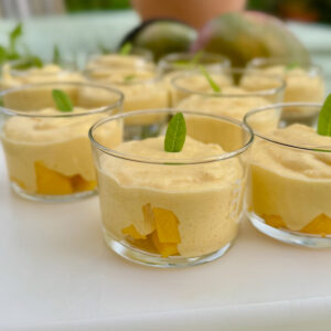 individual mango cream desserts, lightly whipped cream with coconut milk and fresh puréed mango