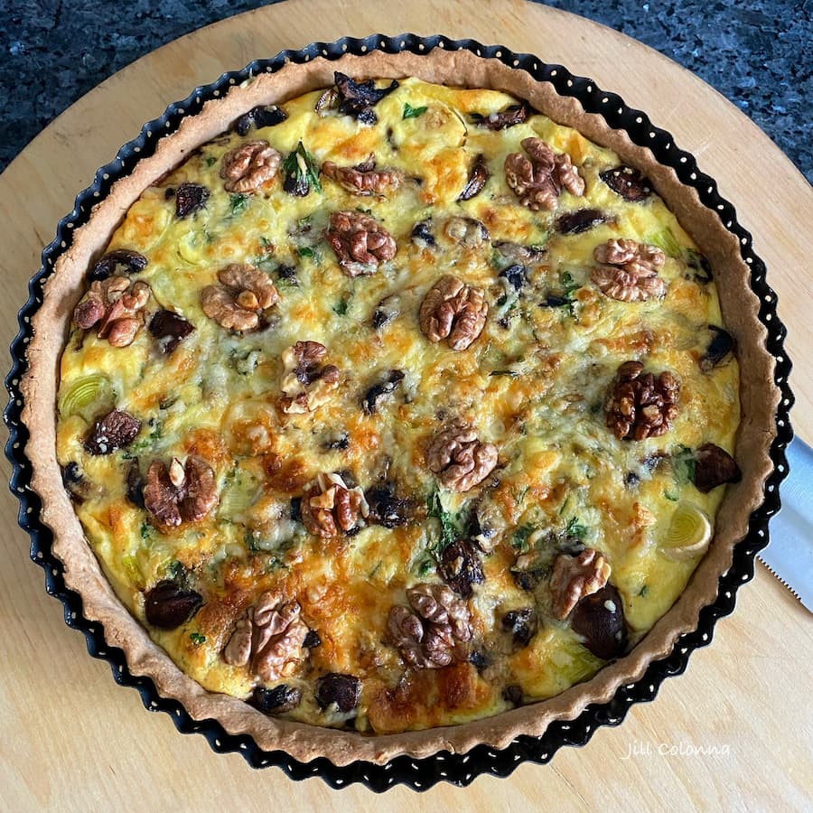 chestnut flour round tart with mushrooms and walnuts
