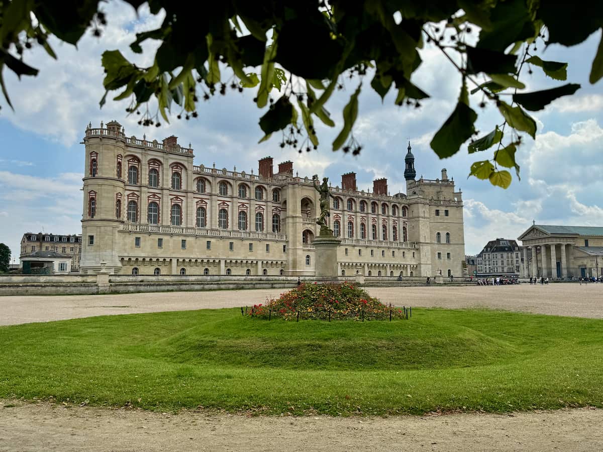 Saint Germain-en-Laye castle from the ground under a lime blossom tree