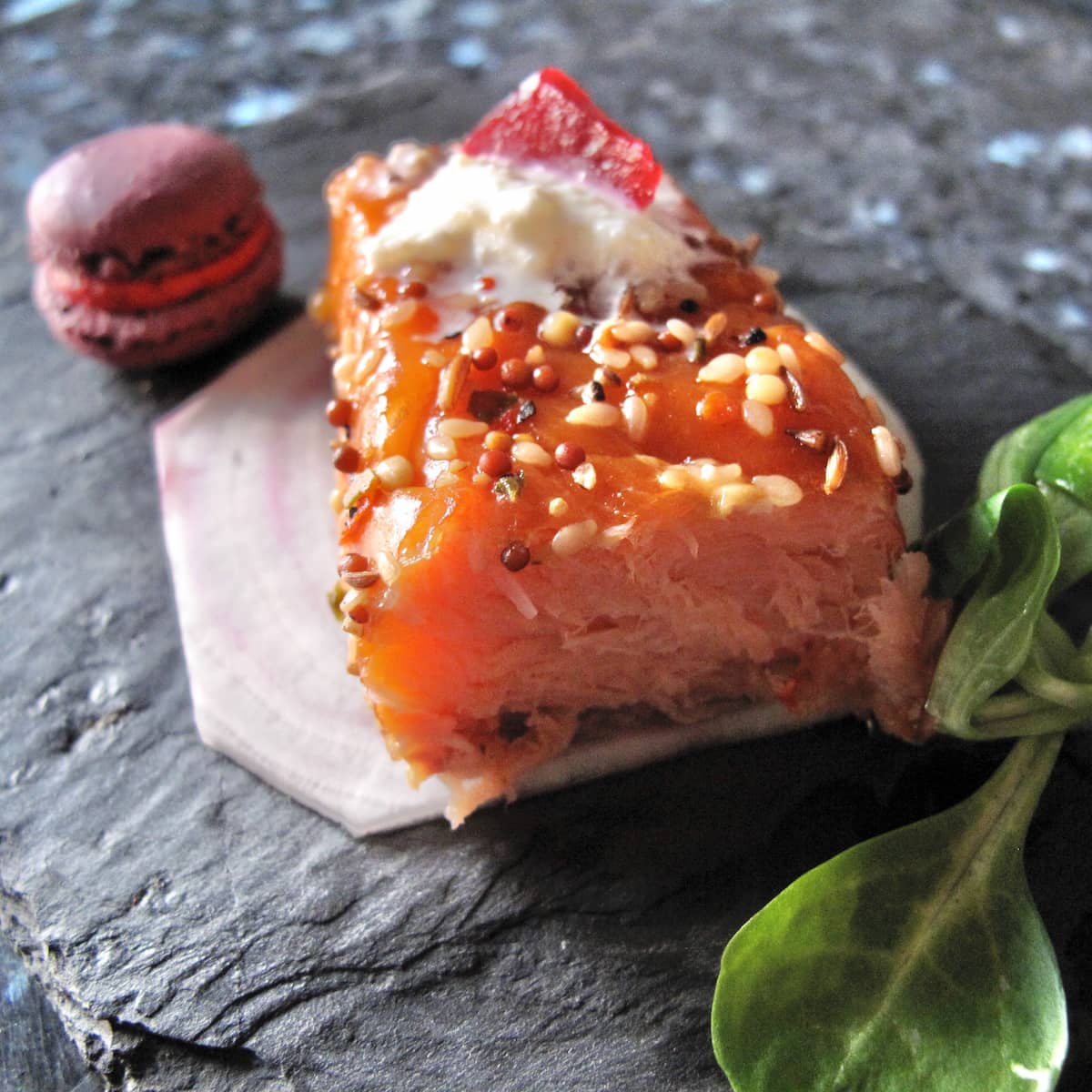hot smoked salmon with a mini beetroot macaron with spicy horseradish