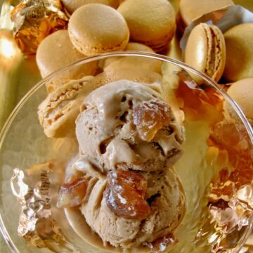 scoops of light chestnut coloured ice cream topped with candied chestnuts