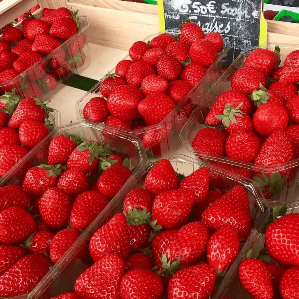 punnets of fresh strawberries at a French market
