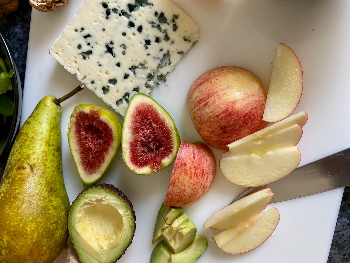 fresh figs with slices of apple and pear with a large slice of French blue cheese, Roquefort