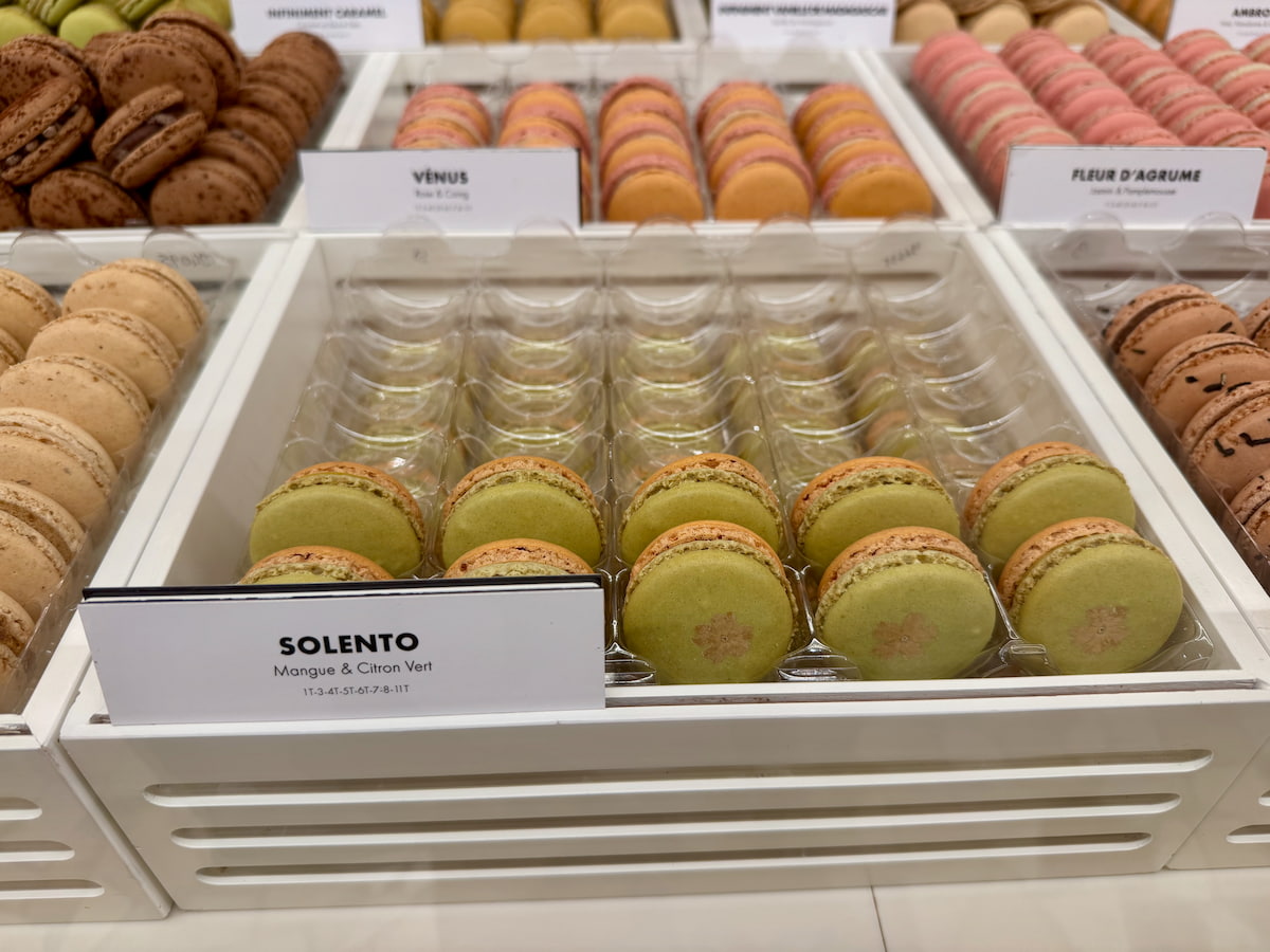 rows of green and yellow duo-coloured macarons by Pierre Hermé Paris called Solento of mango and lime