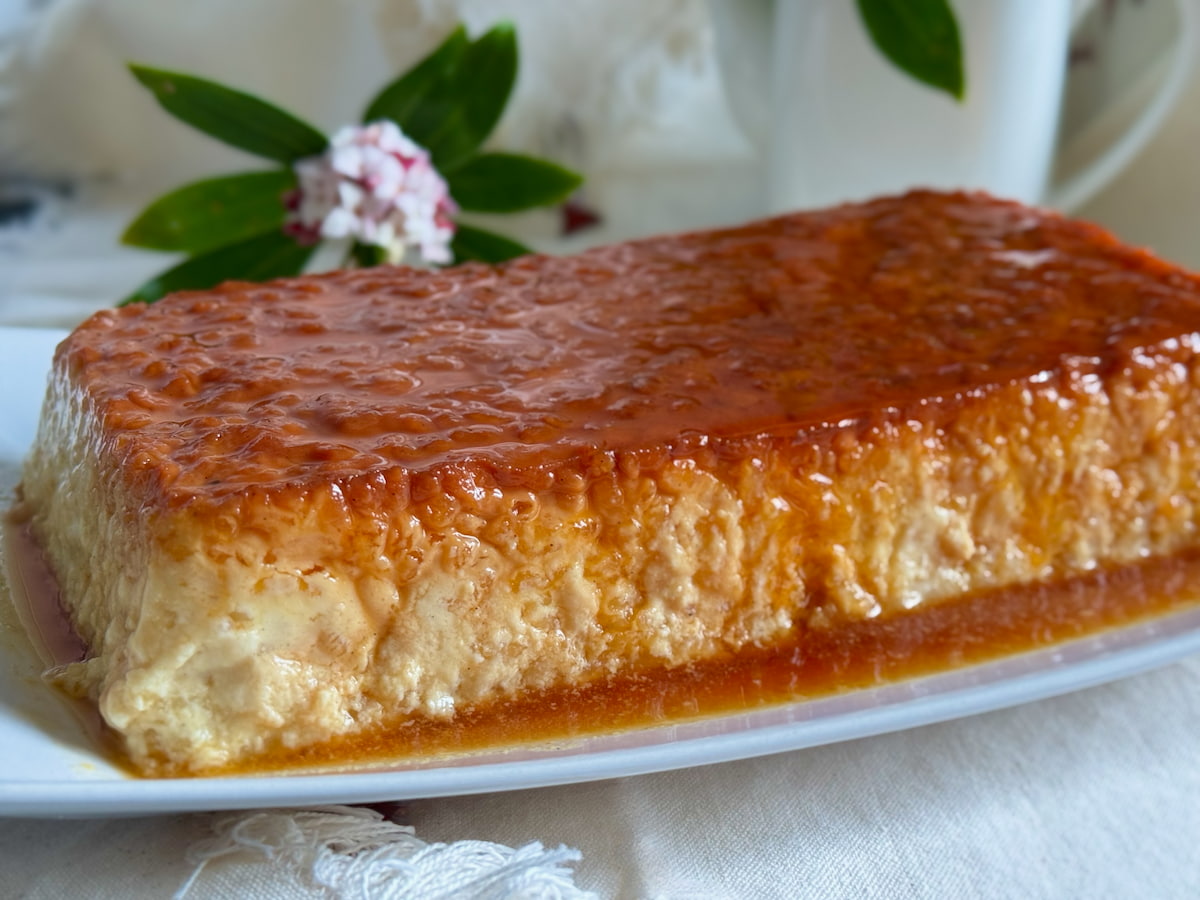 large rice pudding topped and dribbling with caramel sauce