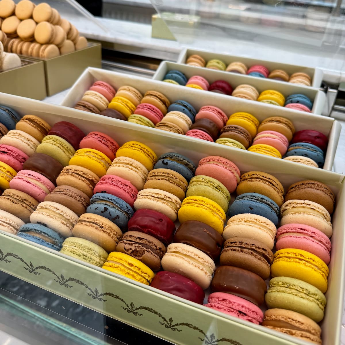 large box of highly coloured Parisian macarons from Laduree
