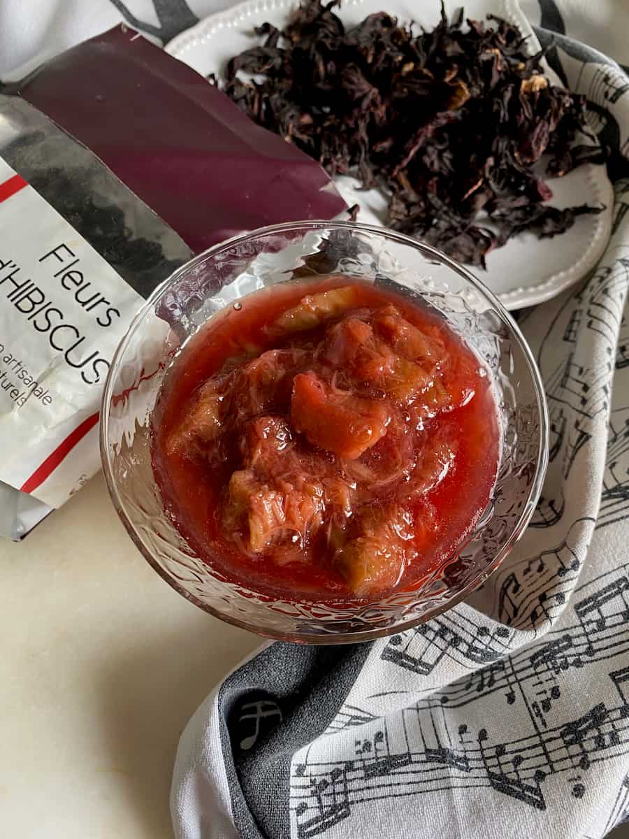 bowl of bright deep pink rhubarb compote