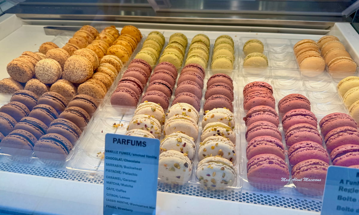 rows of natural coloured French macarons by Une Glace à Paris