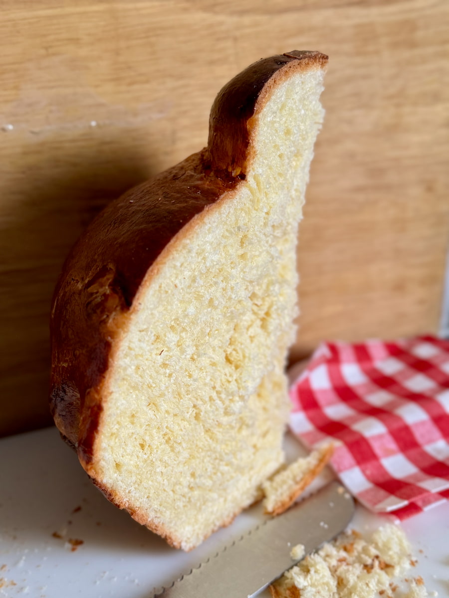 large Parisian brioche cut through to see the light fluffy inside dough