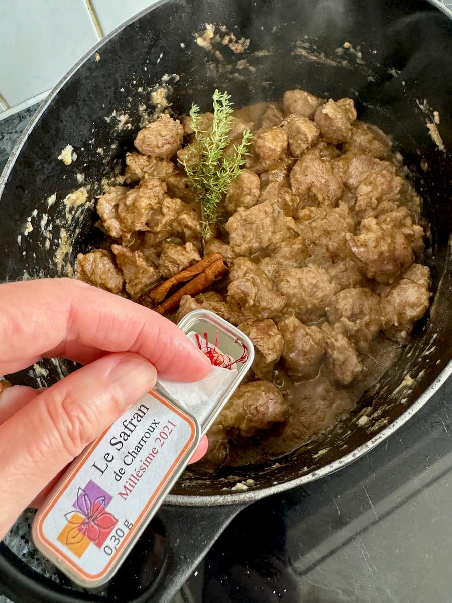 Adding a few strands of saffron to a tagine dish