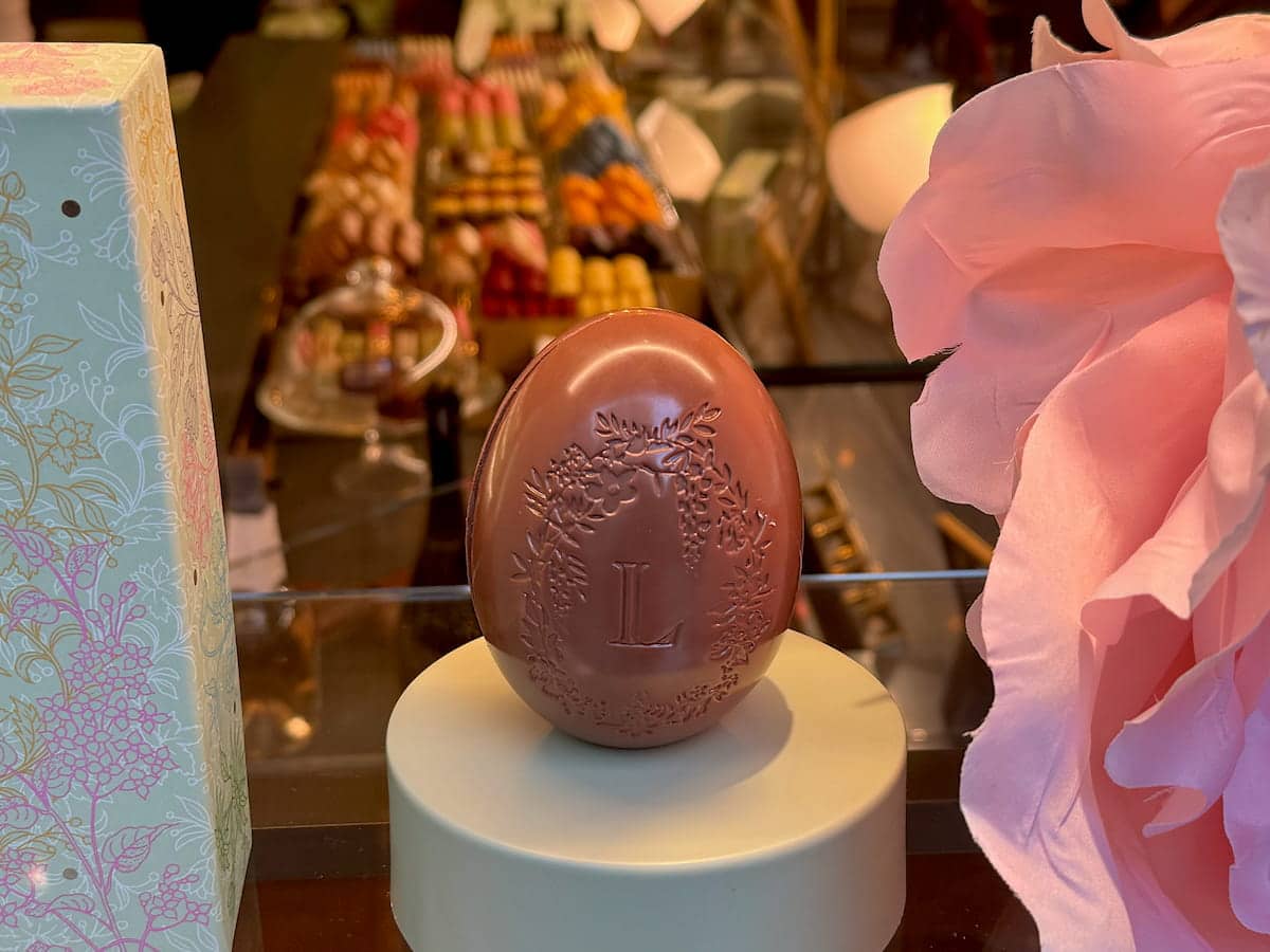 plain chocolate egg in the window of Laduree in Paris