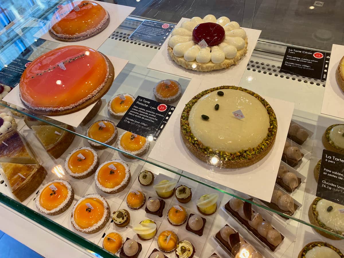 Paris pastry shop window filled with glistening tarts