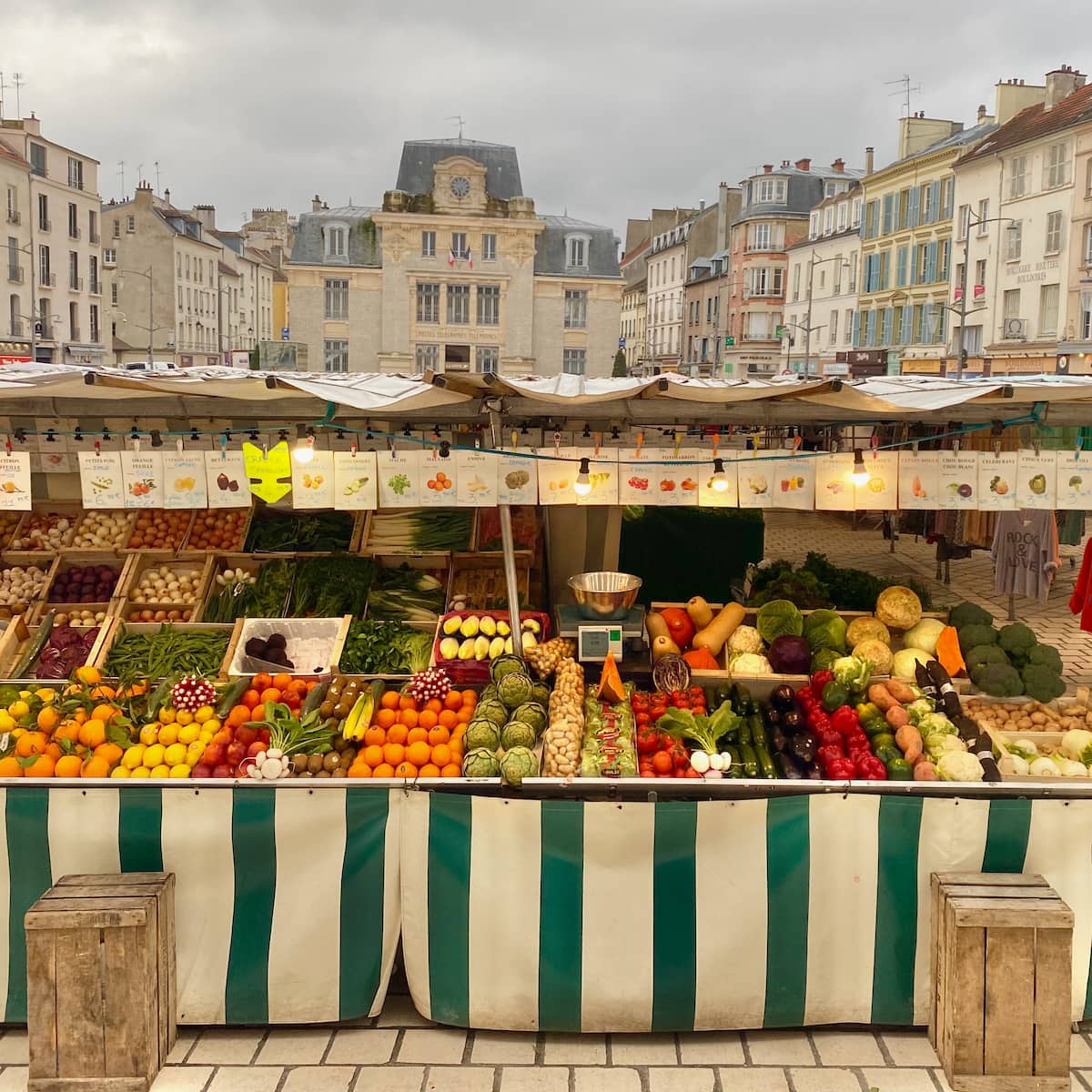 stalls of fruit and vegetables at a French market