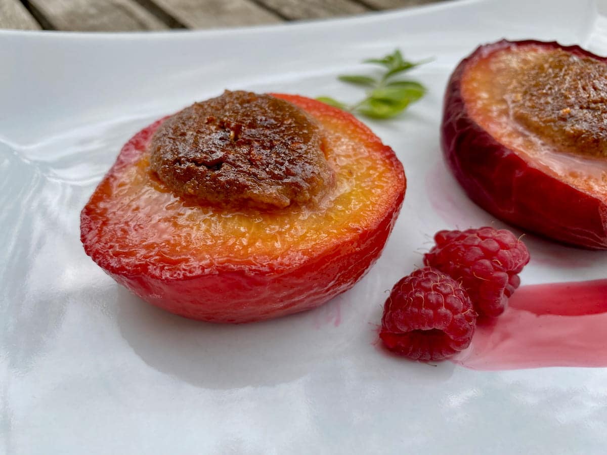 baked peach without skin and with a stuffing that looks like a peach stone