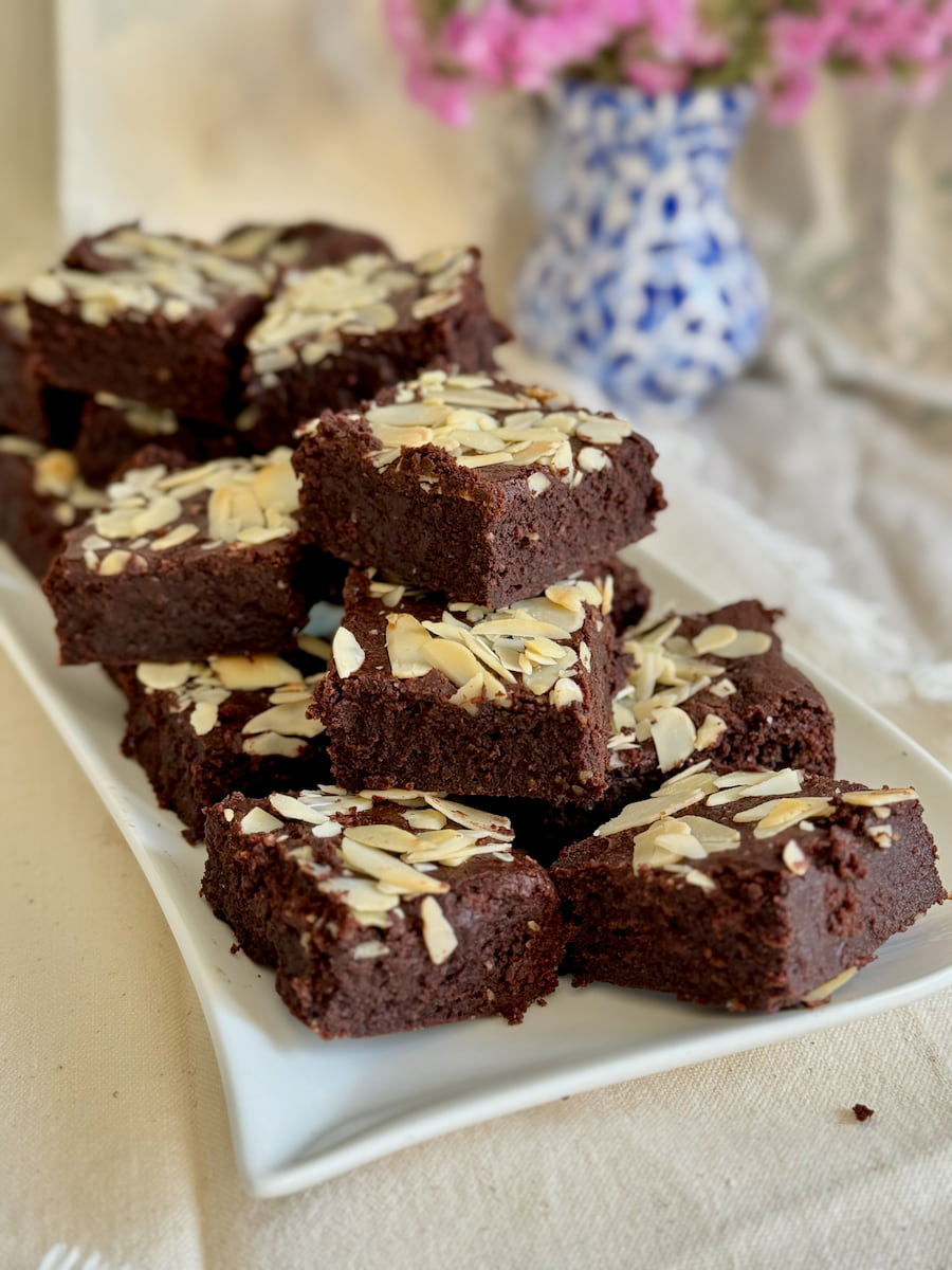 plate of moist chocolate brownie squares without flour, made with almonds