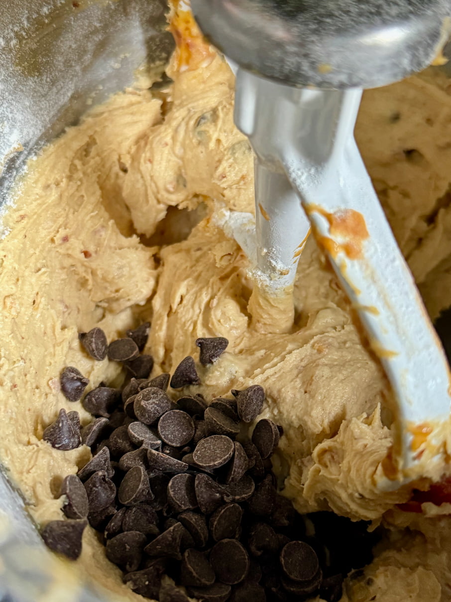 chunky peanut butter in a stand mixer with bittersweet chocolate chips
