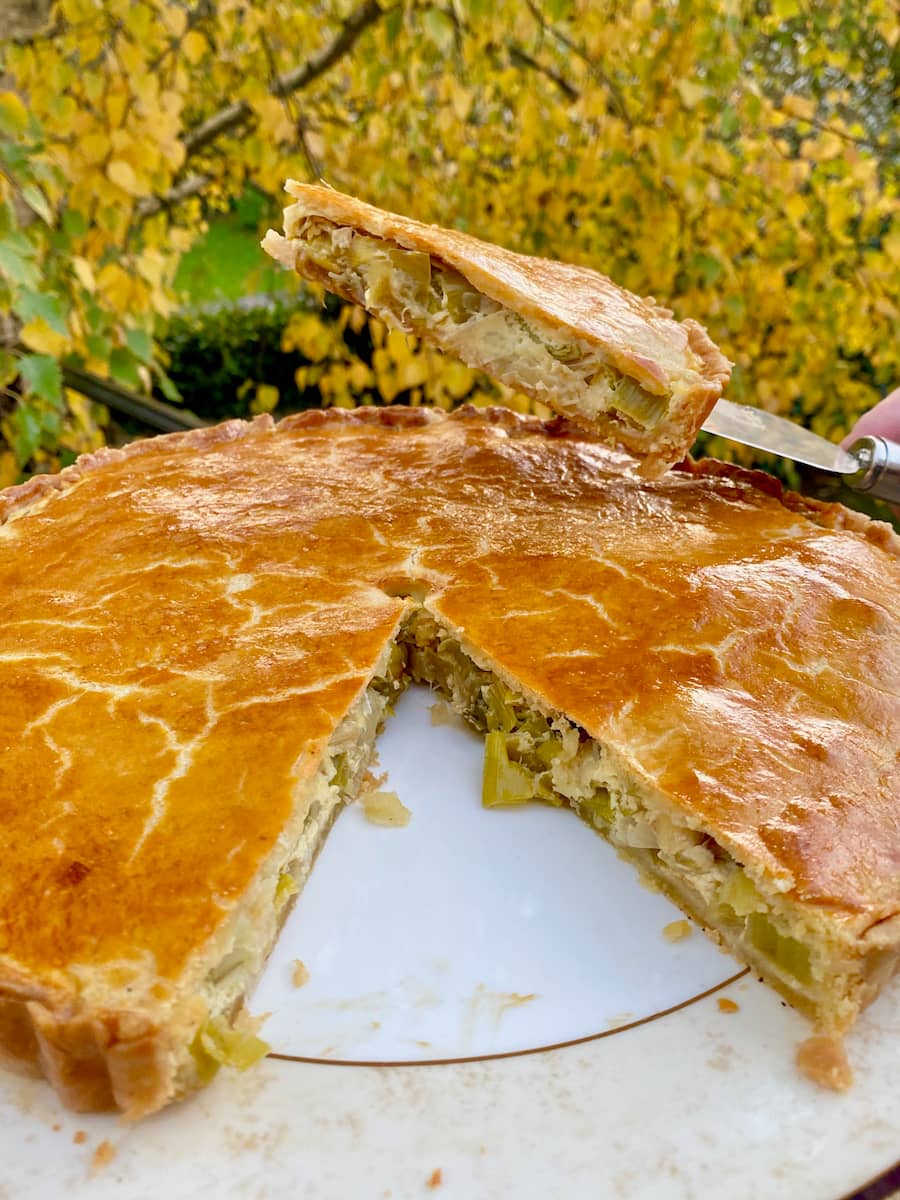 golden thin pie crust filled with buttered leeks