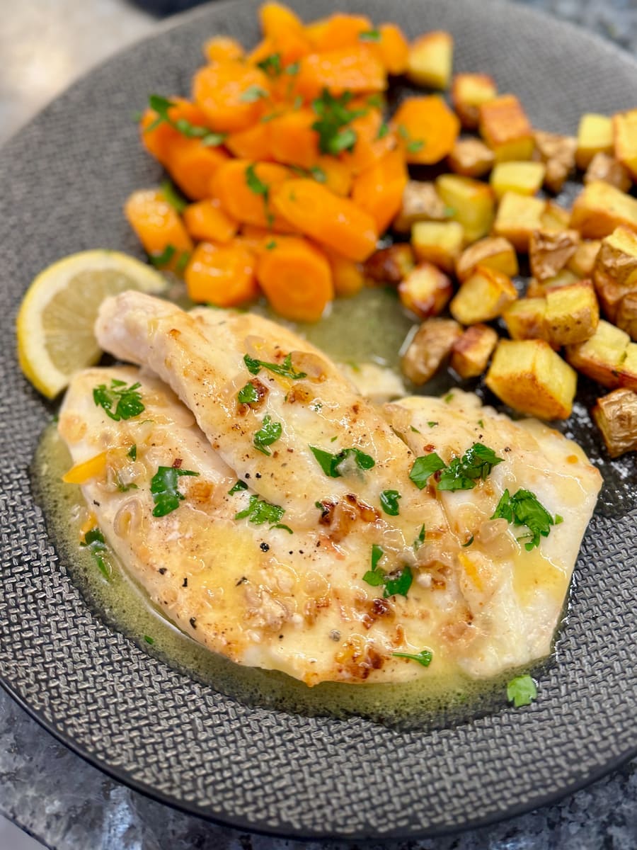 John Dory fish fillet covered in a simple pan-fried sauce with shallots, butter, wine and lemon