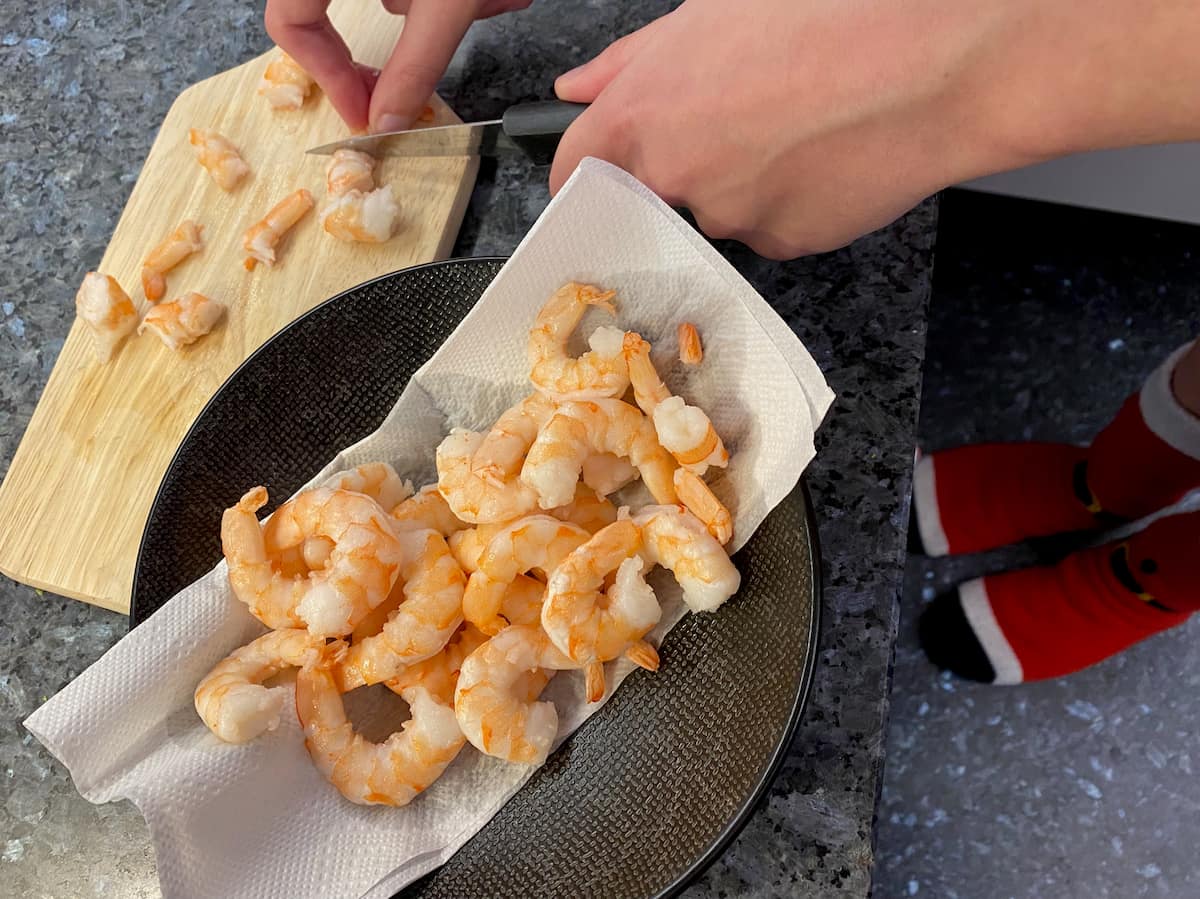 precooked large shrimp or prawns and cutting them into bits