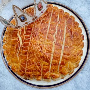 galette des rois French puff pastry almond cake glazed and decorated with a paper crown
