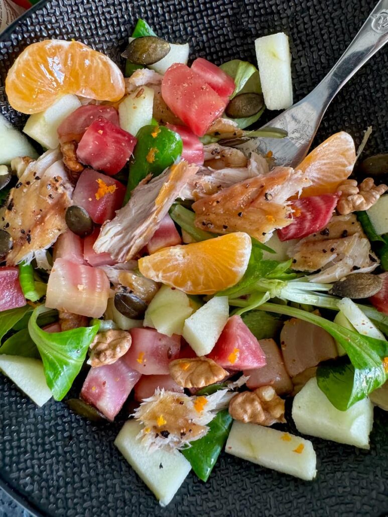 salad with roast beetroot, apple, salad leaves, nuts, seeds and clementine segments