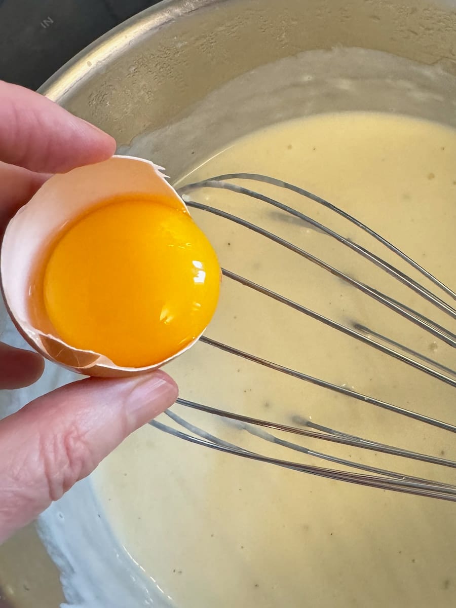 to make a bechamel cheese sauce add egg yolk and grated emmental or parmesan