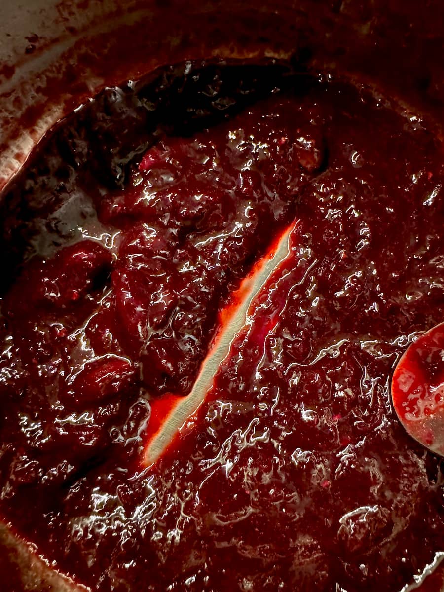 thickened cherry sauce - a spoon cut through the middle to show it's thick