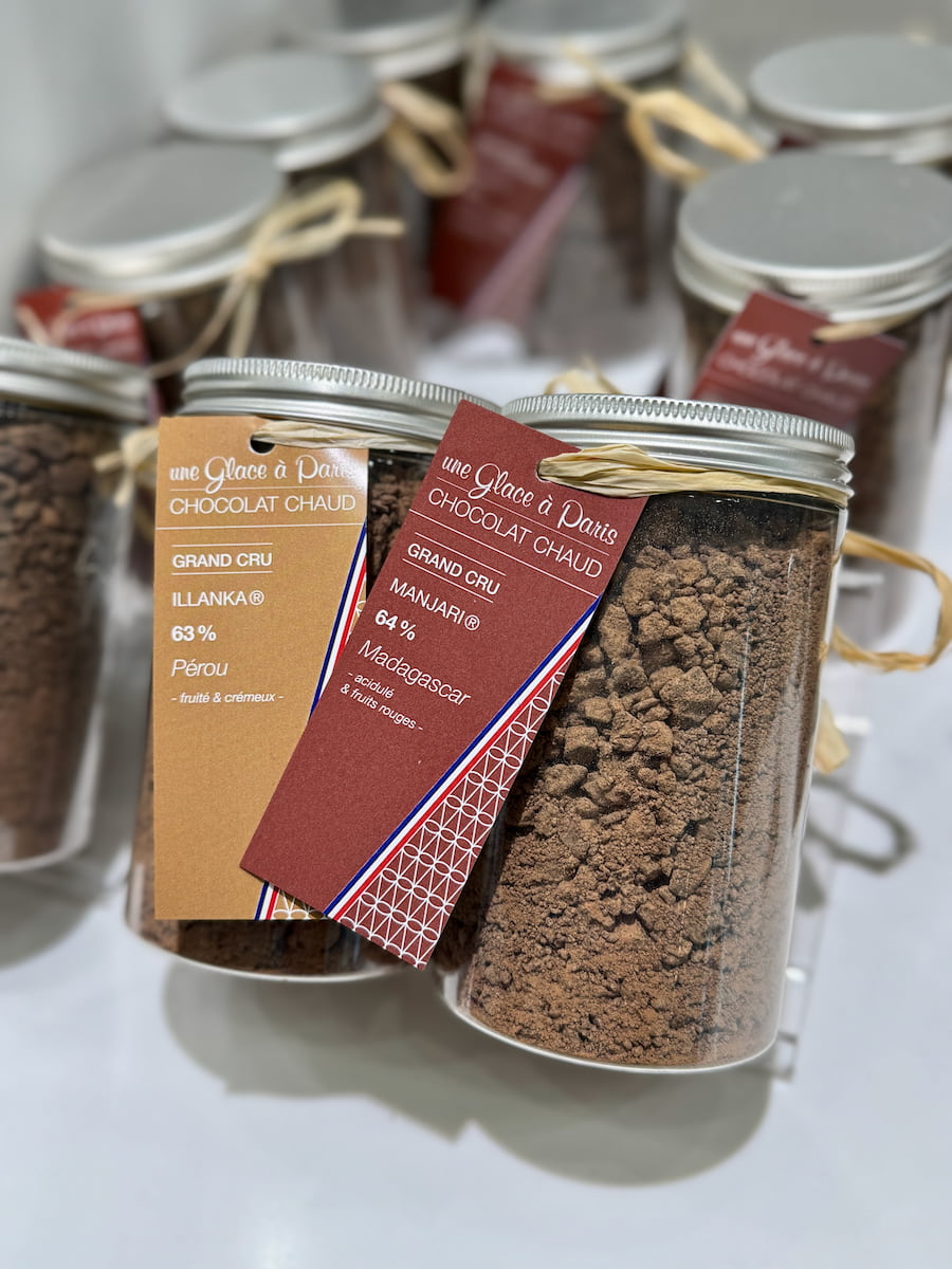 jars of cocoa powder from a shop in Paris from Peru and Madagascar for the best hot chocolate to make at home