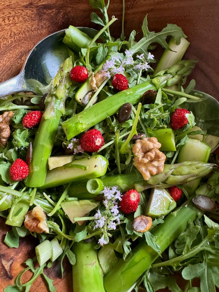 green salad tossed in French dressing with added toasted nuts, herb flowers and wild strawberries