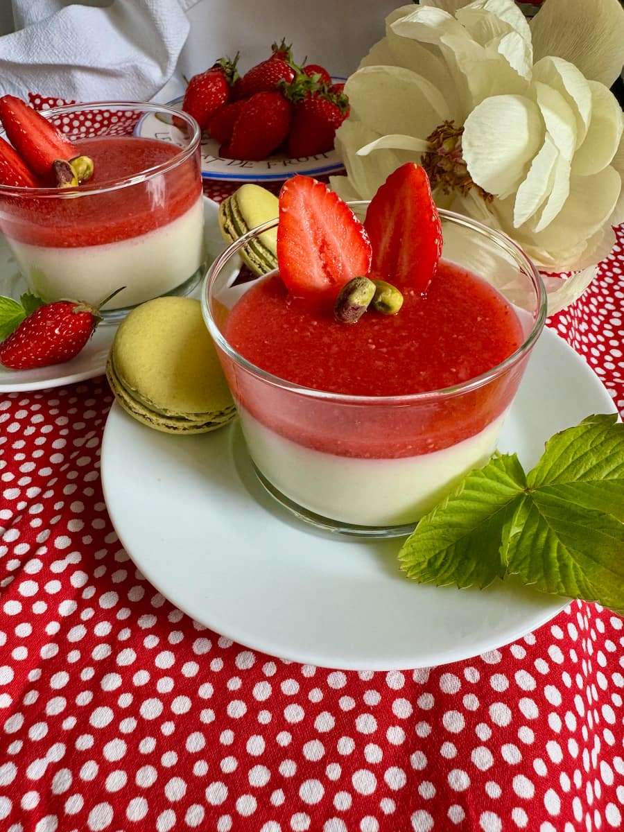 panna cotta creamy dessert with a strawberry coulis topping