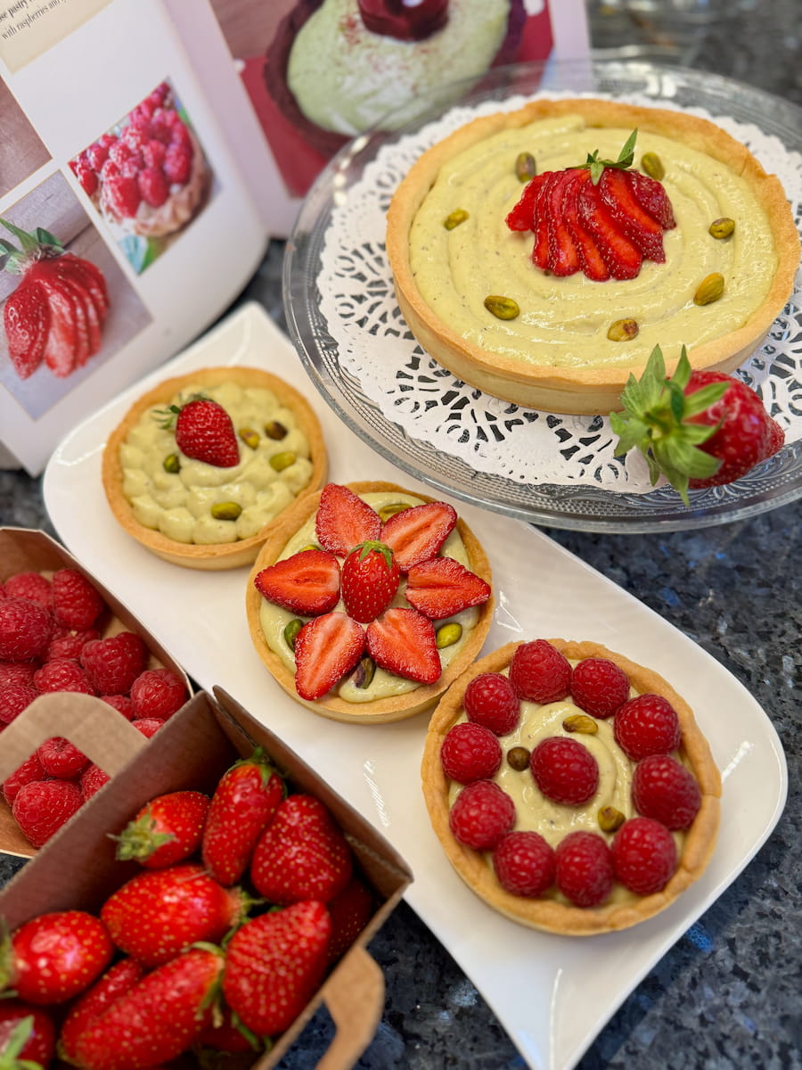 strawberry tarts with pistachio pastry cream in different sizes=
