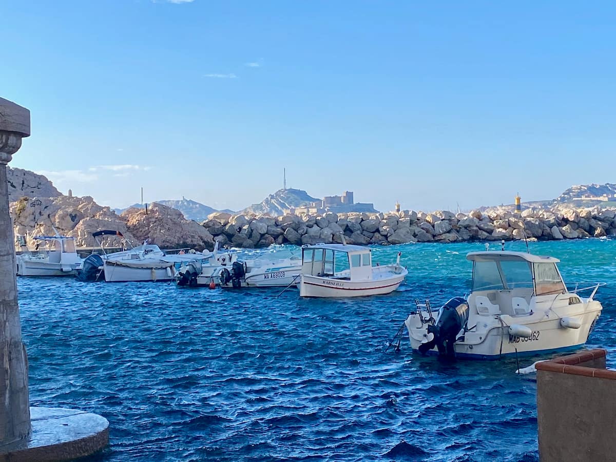 boats looking out to the island of chateau d'if off the coast of Marseille