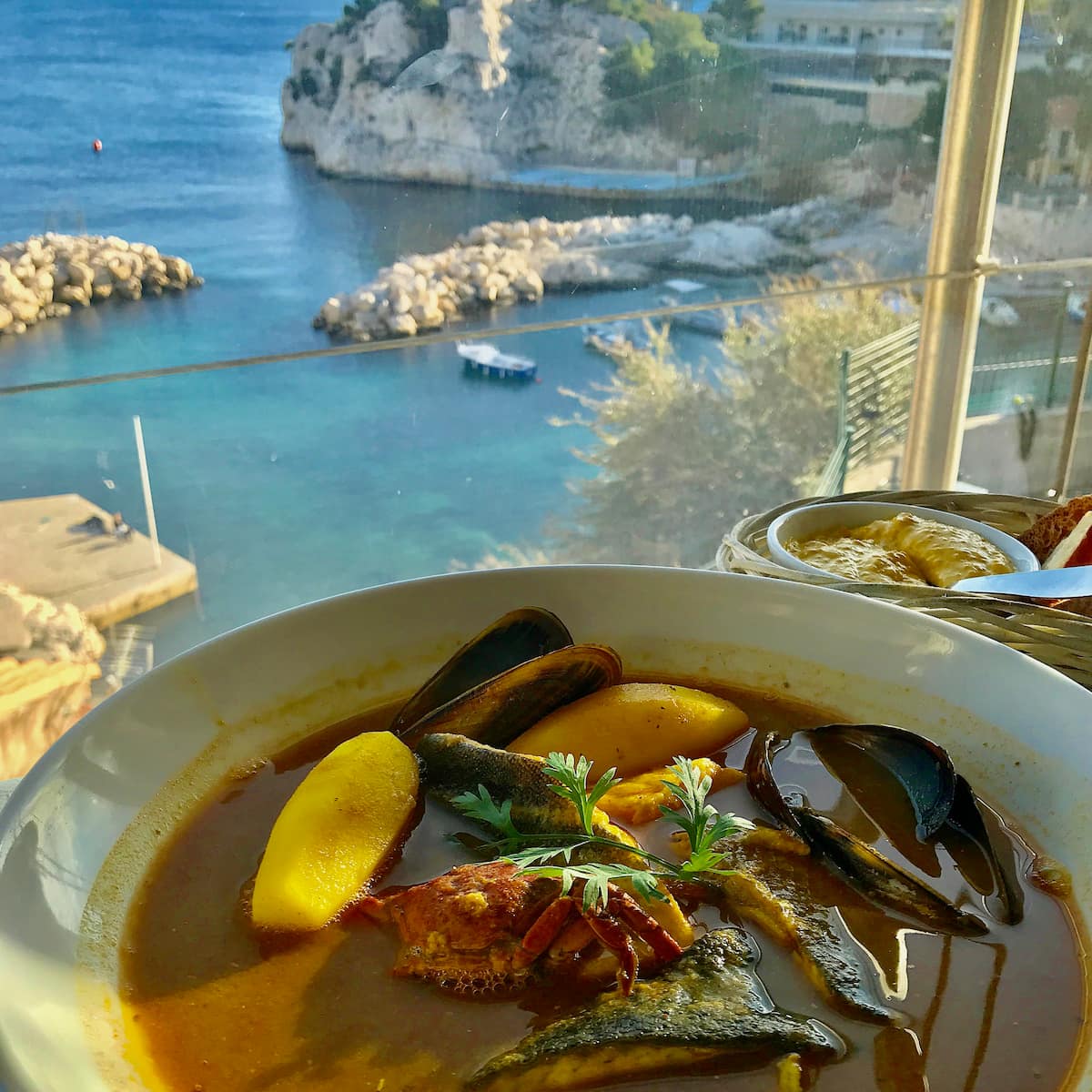 a bowl of Bouillabaisse, the speciality of Marseille by the sea
