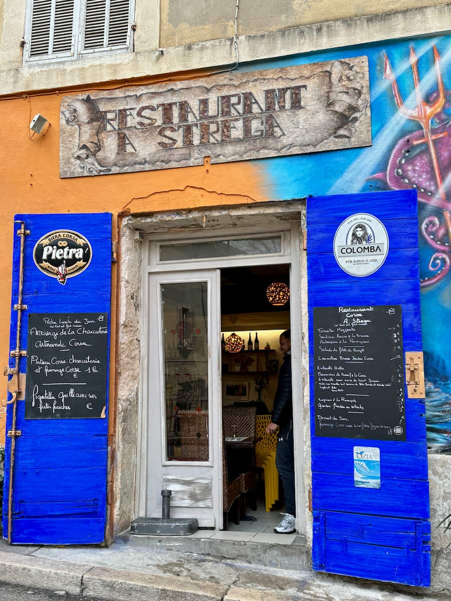 big blue shutters of a Corsican restaurant in Marseille