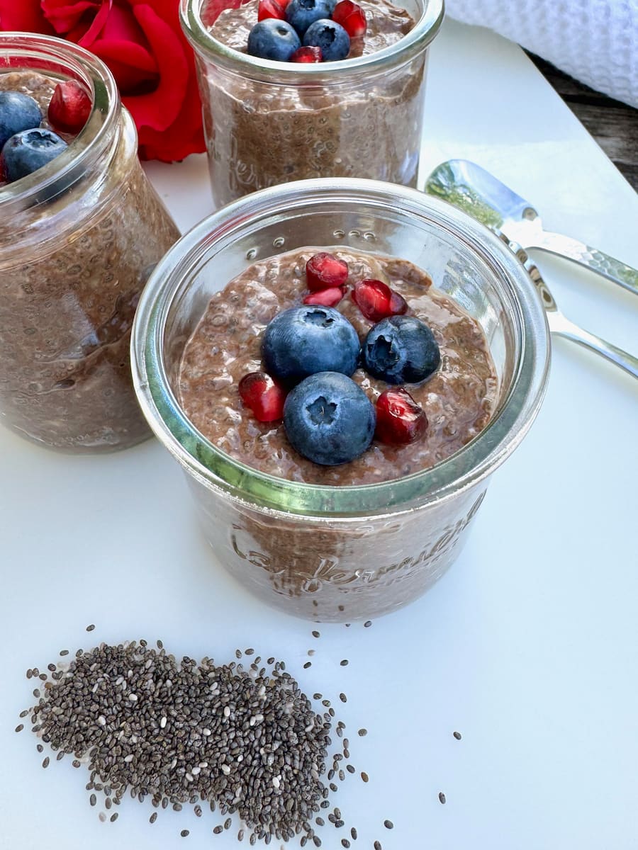 thickened chocolate chia pudding topped with fruits