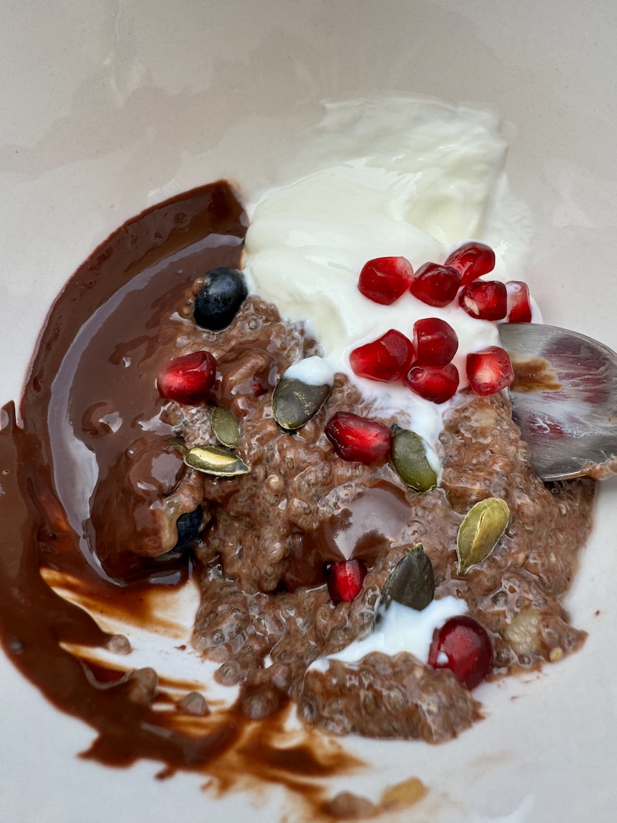 chocolate chia pudding served with dark chocolate sauce and yoghurt