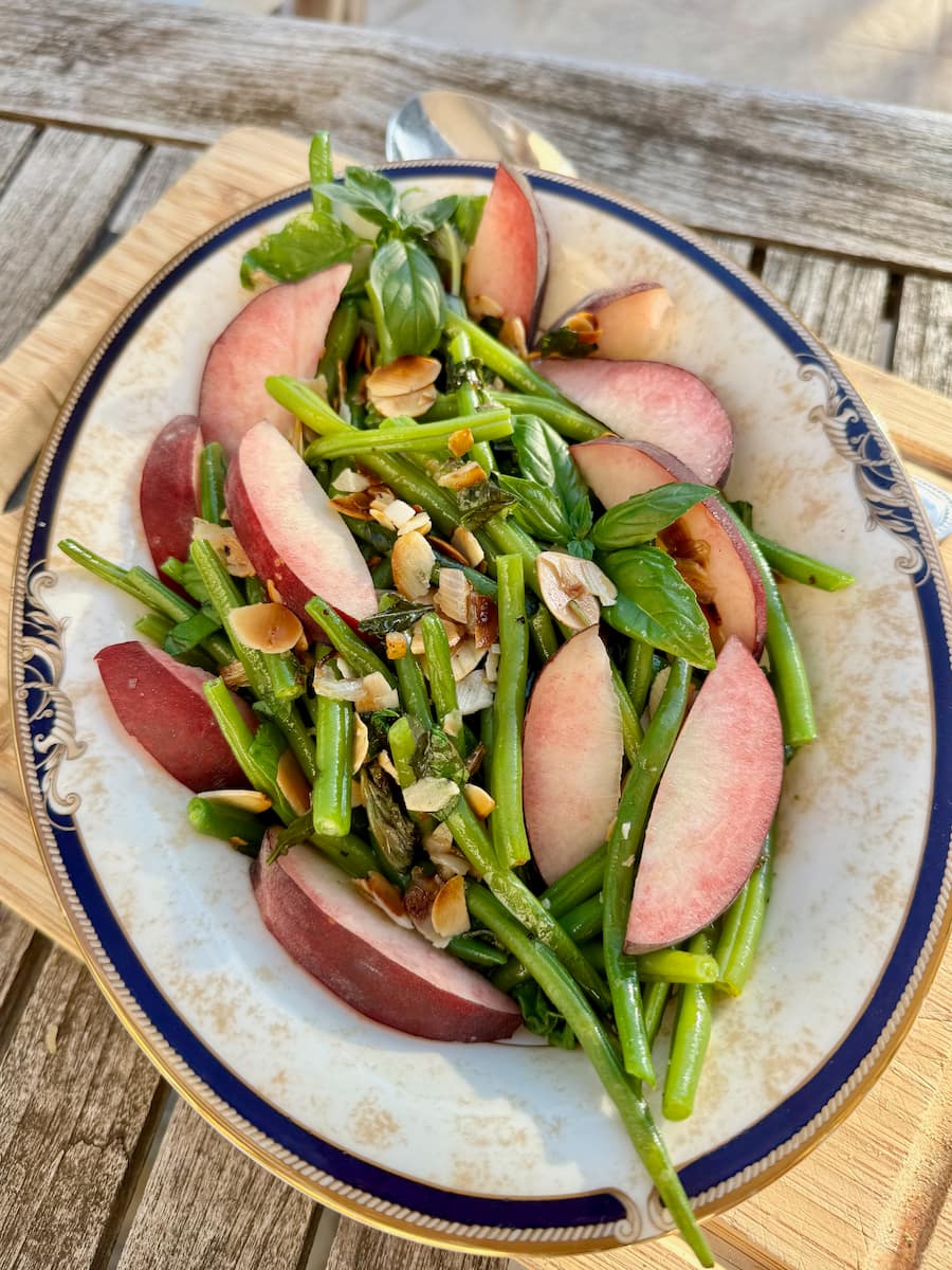 green beans tossed in olive oil, toasted almonds, shallot and a sliced white peach