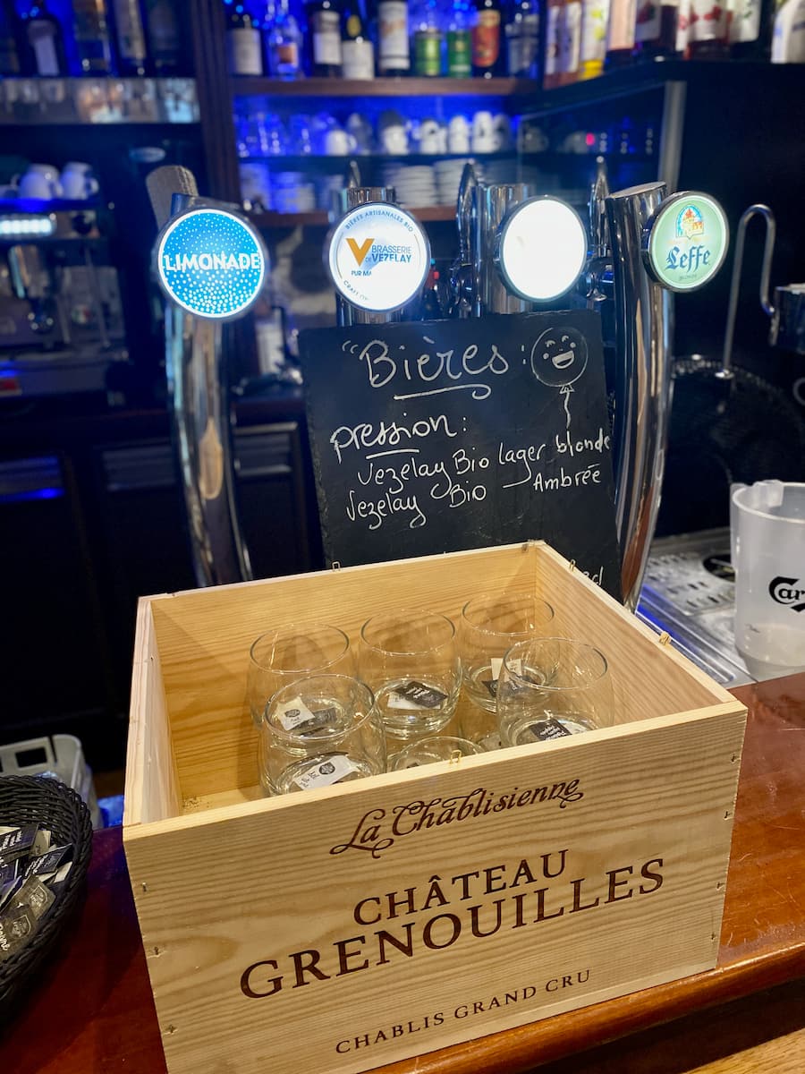 draught beer levers in a French brasserie with a Burgundy wine box