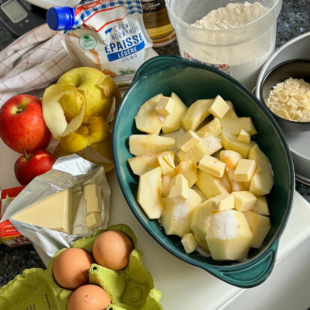 baked apples with butter in a gratin dish with apple cake ingredients
